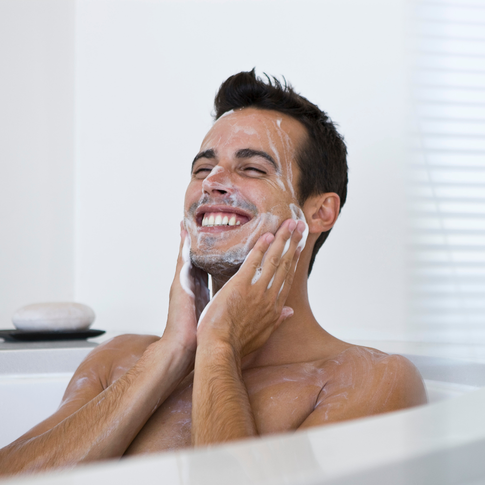 male model washing his face